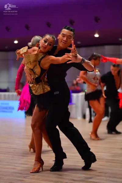 Dancesport competitor: Male dancer: black long-sleeved shirt and black trousers