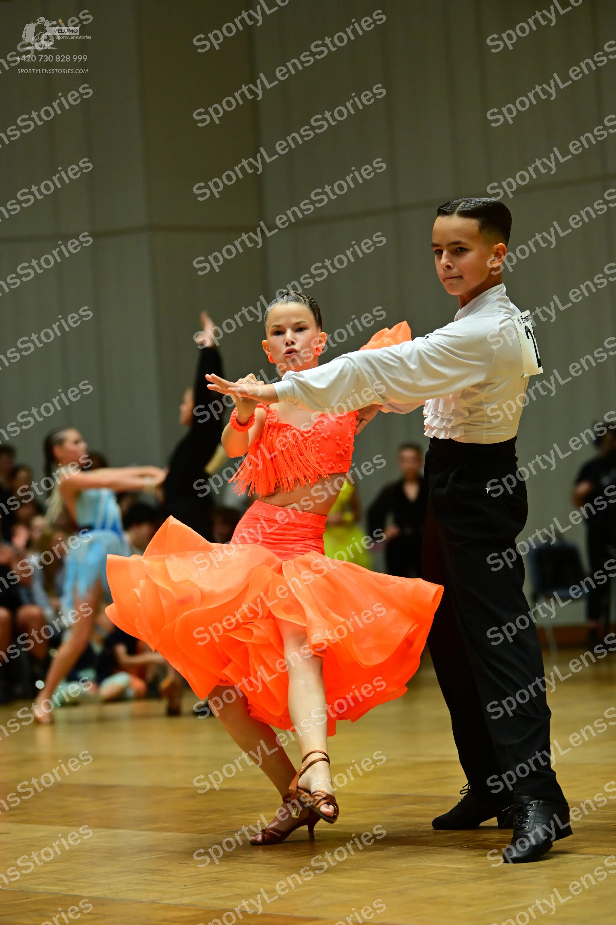 Dancesport competitor: Male dancer: white long-sleeved shirt and black trousers