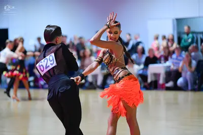 Dancesport competitor #629: Male dancer: black long-sleeved shirt and black trousers
