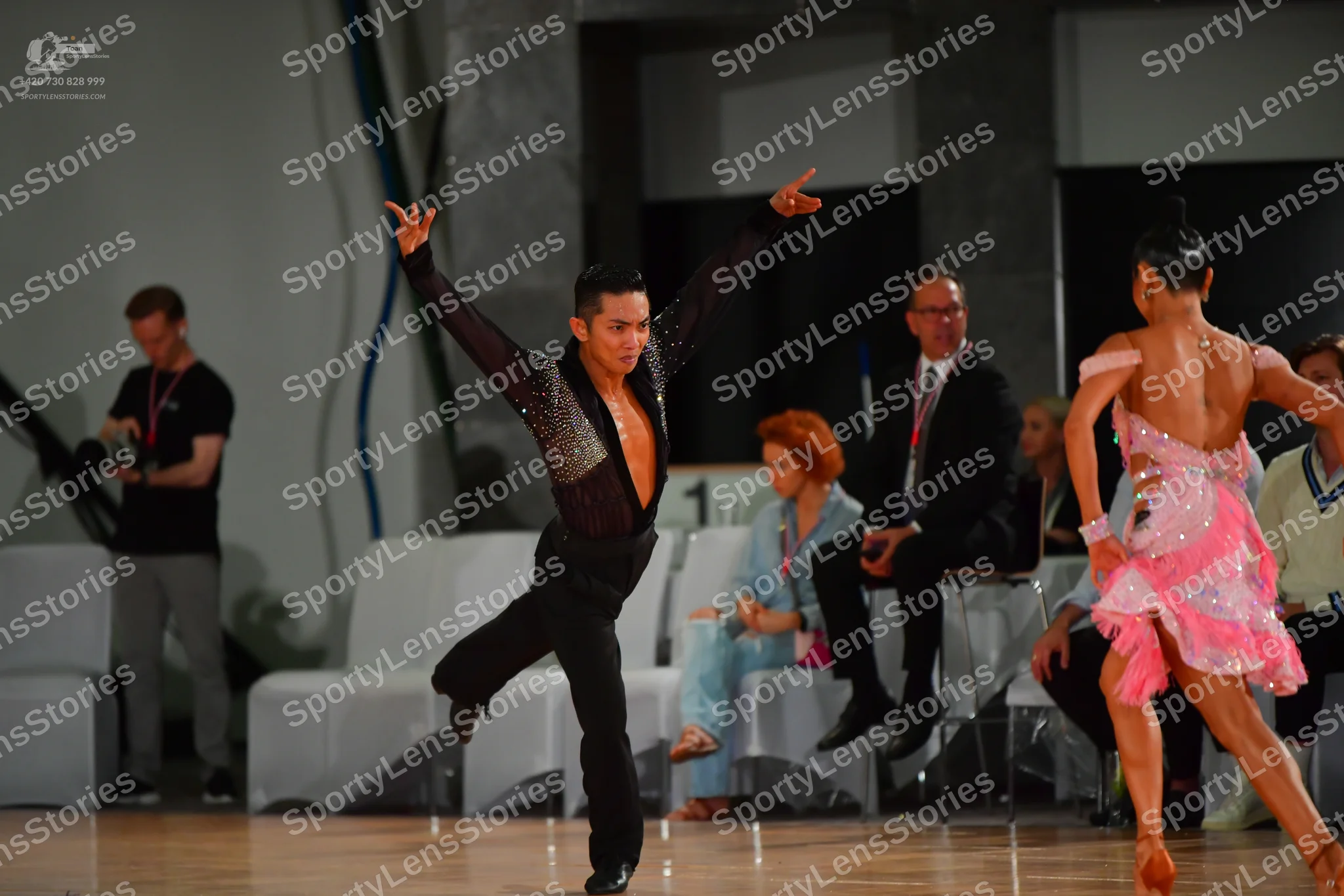Dancesport competitor: Male dancer: black long-sleeved shirt with sequin detailing on the chest/front a