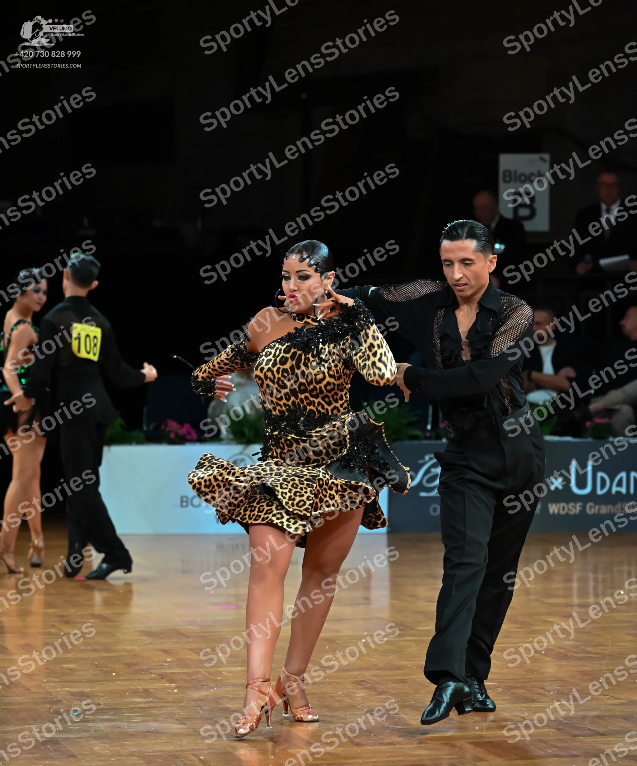 Dancesport competitor: Female dancer (far left): black latin dress