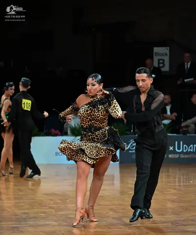 Dancesport competitor: Female dancer (far left): black latin dress