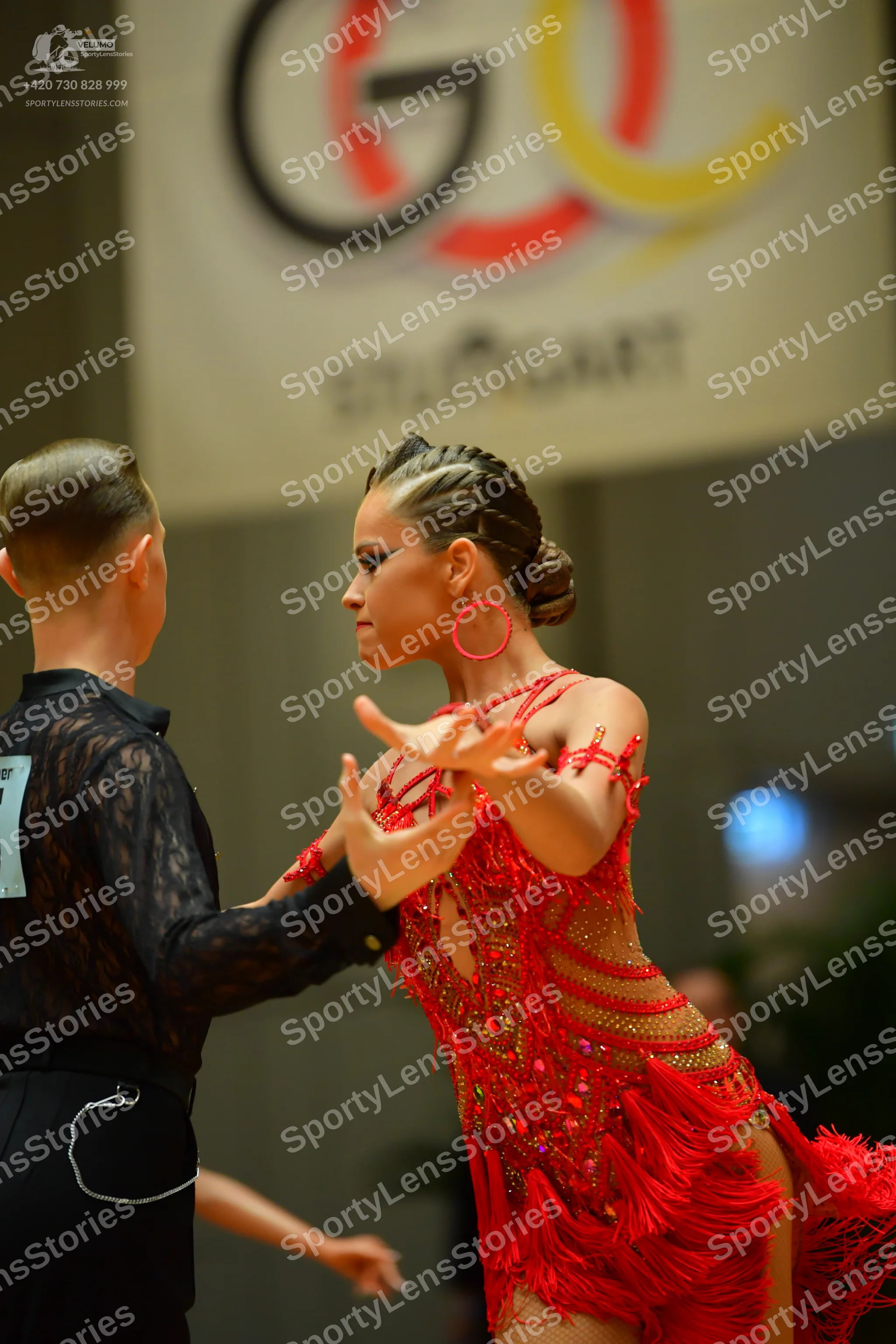 Dancesport competitor: Male dancer: black long-sleeved shirt with a lace pattern and black trousers