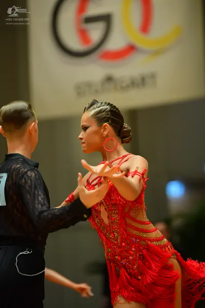 Dancesport competitor: Male dancer: black long-sleeved shirt with a lace pattern and black trousers