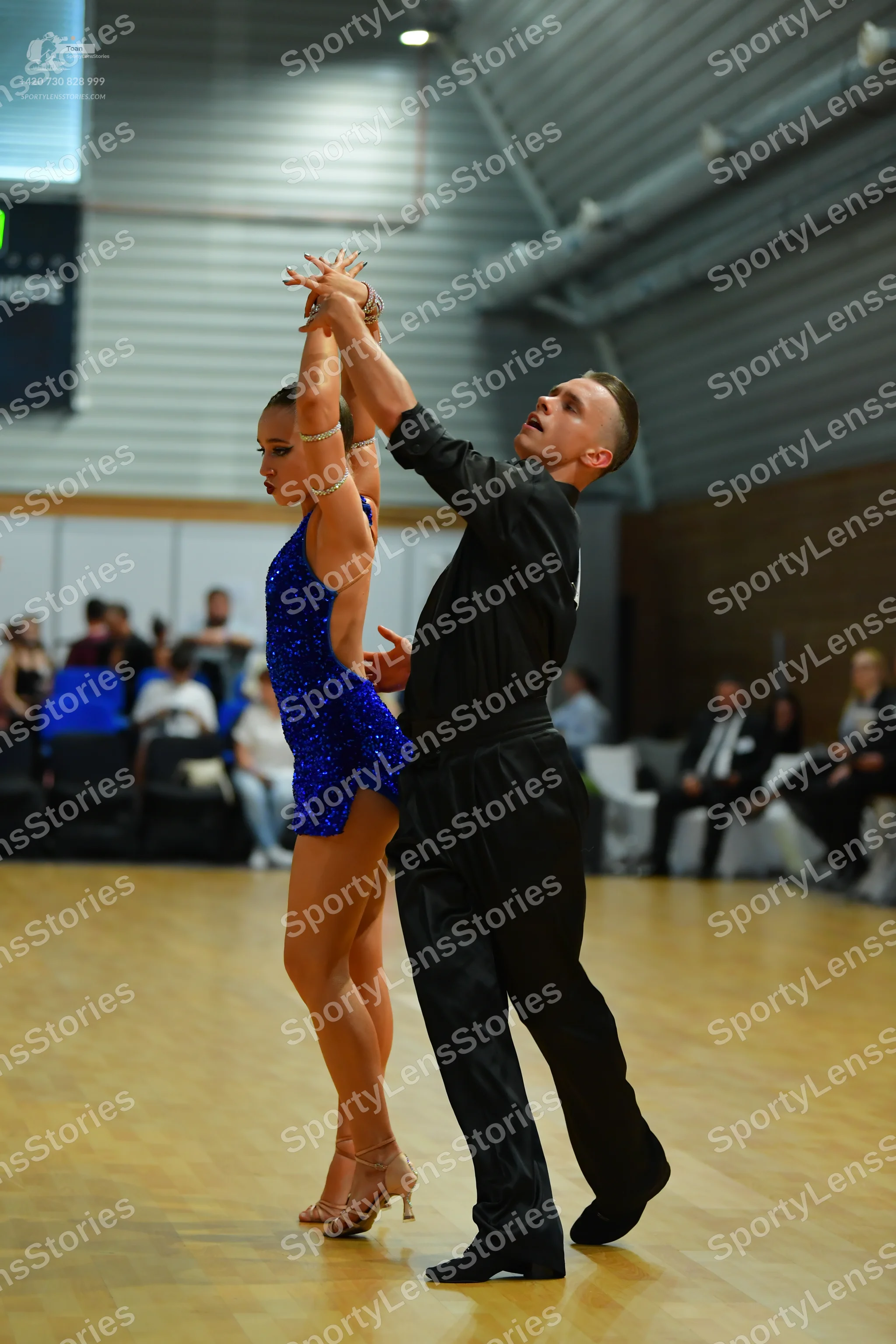 Dancesport competitor #999: Male** - Black tailsuit with sequin lapels