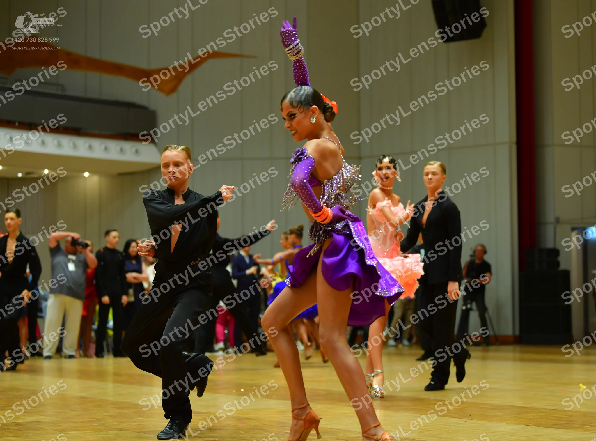 Dancesport competitor: Male dancer: black long-sleeved shirt and black trousers