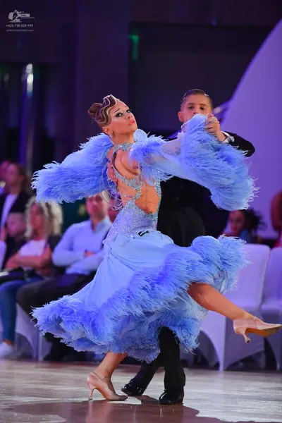 Dancesport competitor: Male dancer: black suit with a white shirt