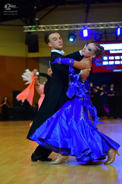 Dancesport competitor: Male dancer: black tailcoat-style suit with a white shirt and white bow tie