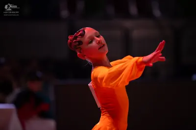 Dancesport competitor: Female dancer: orange latin dress