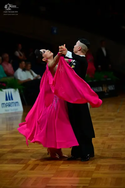 Dancesport competitor: Male dancer: black suit