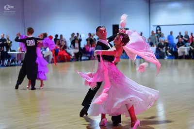 Dancesport competitor #402: Male dancer (left): black suit