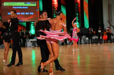 Dancesport competitor: Male dancers: black long-sleeved shirts and black trousers
