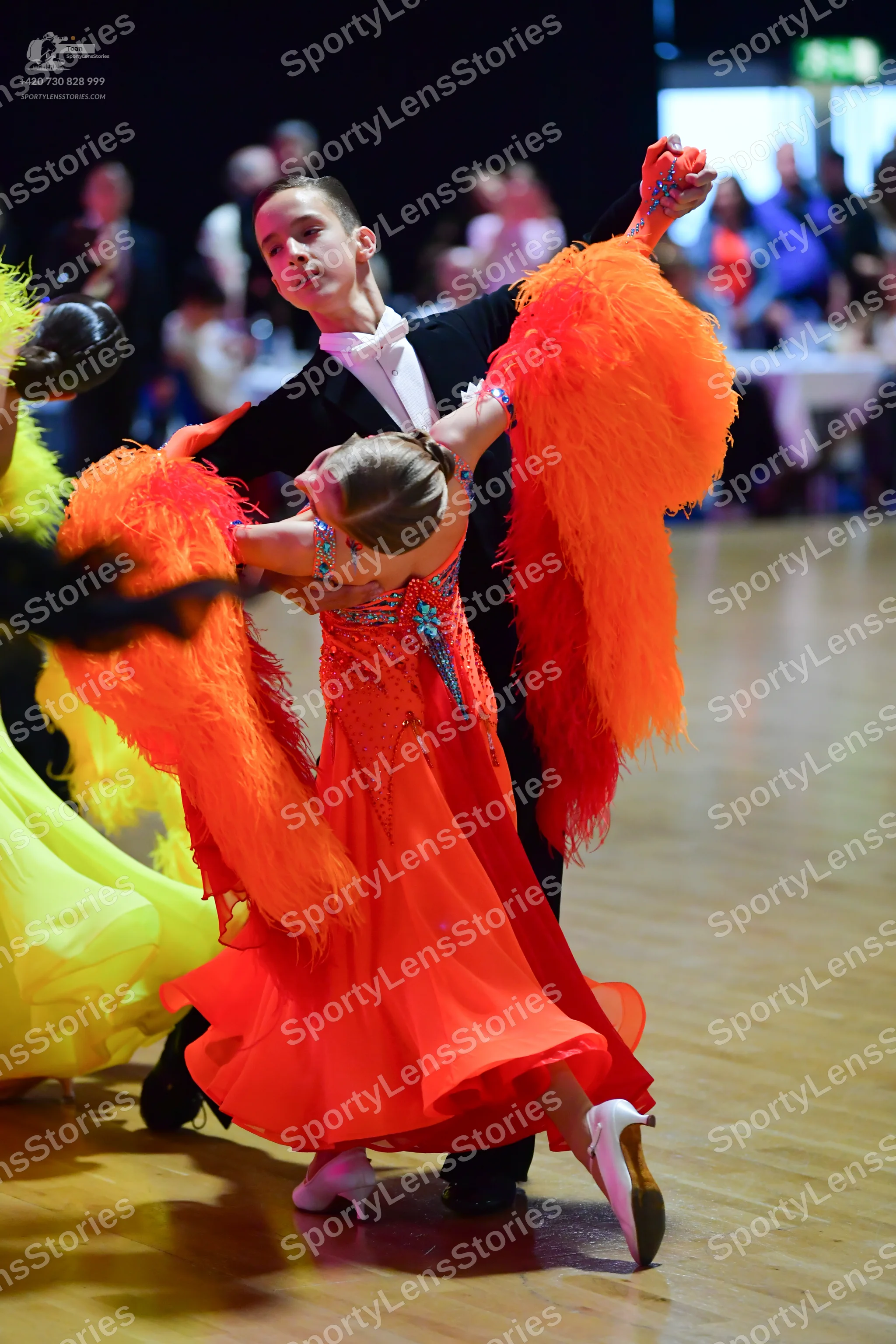 Dancesport competitor: Male dancer: black suit with white shirt and white bowtie