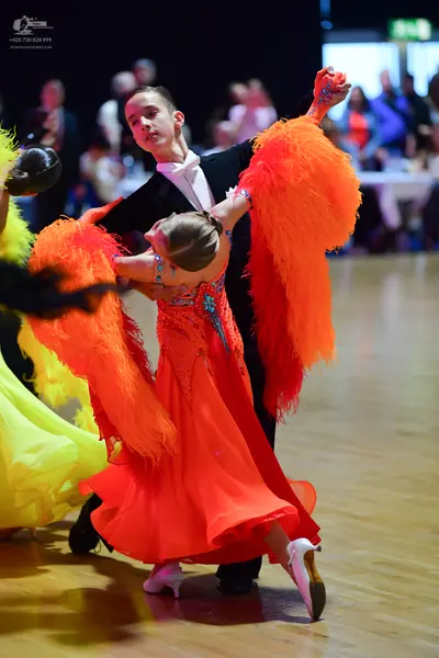 Dancesport competitor: Male dancer: black suit with white shirt and white bowtie