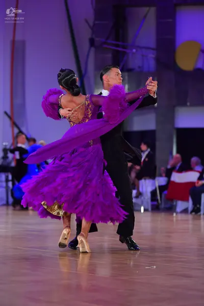 Dancesport competitor: Male dancer: black ballroom suit