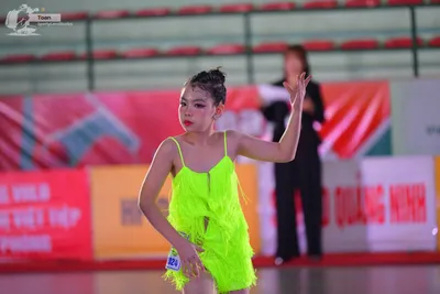 Dancesport competitor: ** Bright Yellow Latin Dress
*   **Color:** Vibrant Yellow
*   **Fabric:** Appea
