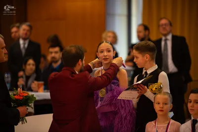 Dancesport competitor: Female dancer: purple latin dress with heavy fringe