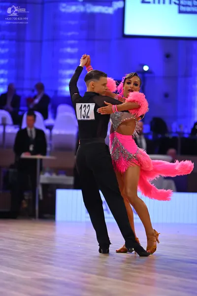Dancesport competitor: Male dancer: black long-sleeved shirt and black trousers
