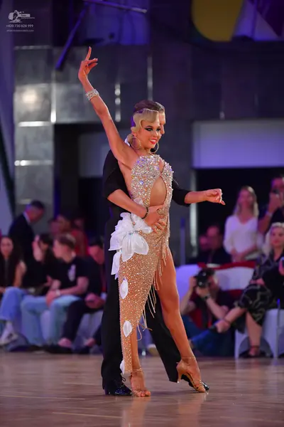 Dancesport competitor: Male dancer: black suit