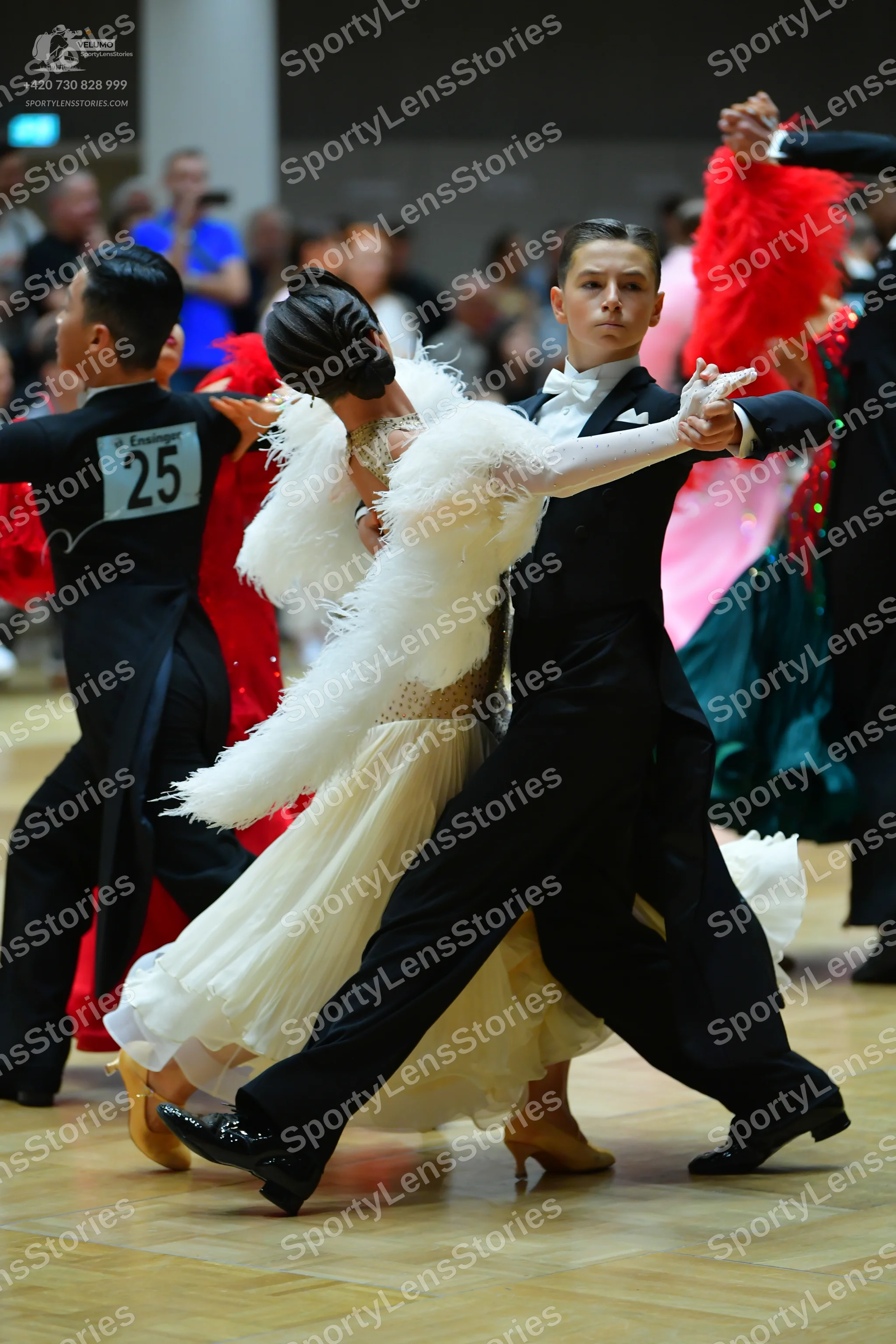 Dancesport competitor #25: Male dancer (left): black ballroom shirt and trousers