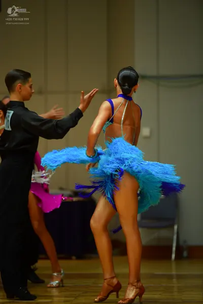 Dancesport competitor: Male dancer: black long-sleeved shirt and black trousers