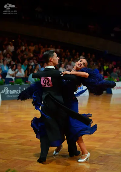 Dancesport competitor: Male dancer: black tailcoat suit with a white shirt and black bow tie