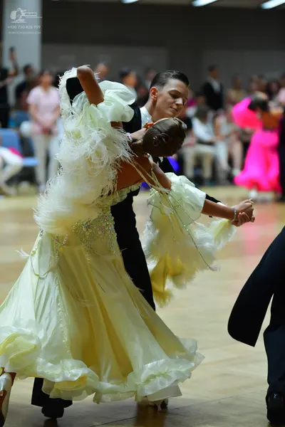Dancesport competitor: Male dancer: black suit