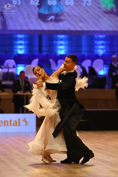 Dancesport competitor: Male dancer: black suit