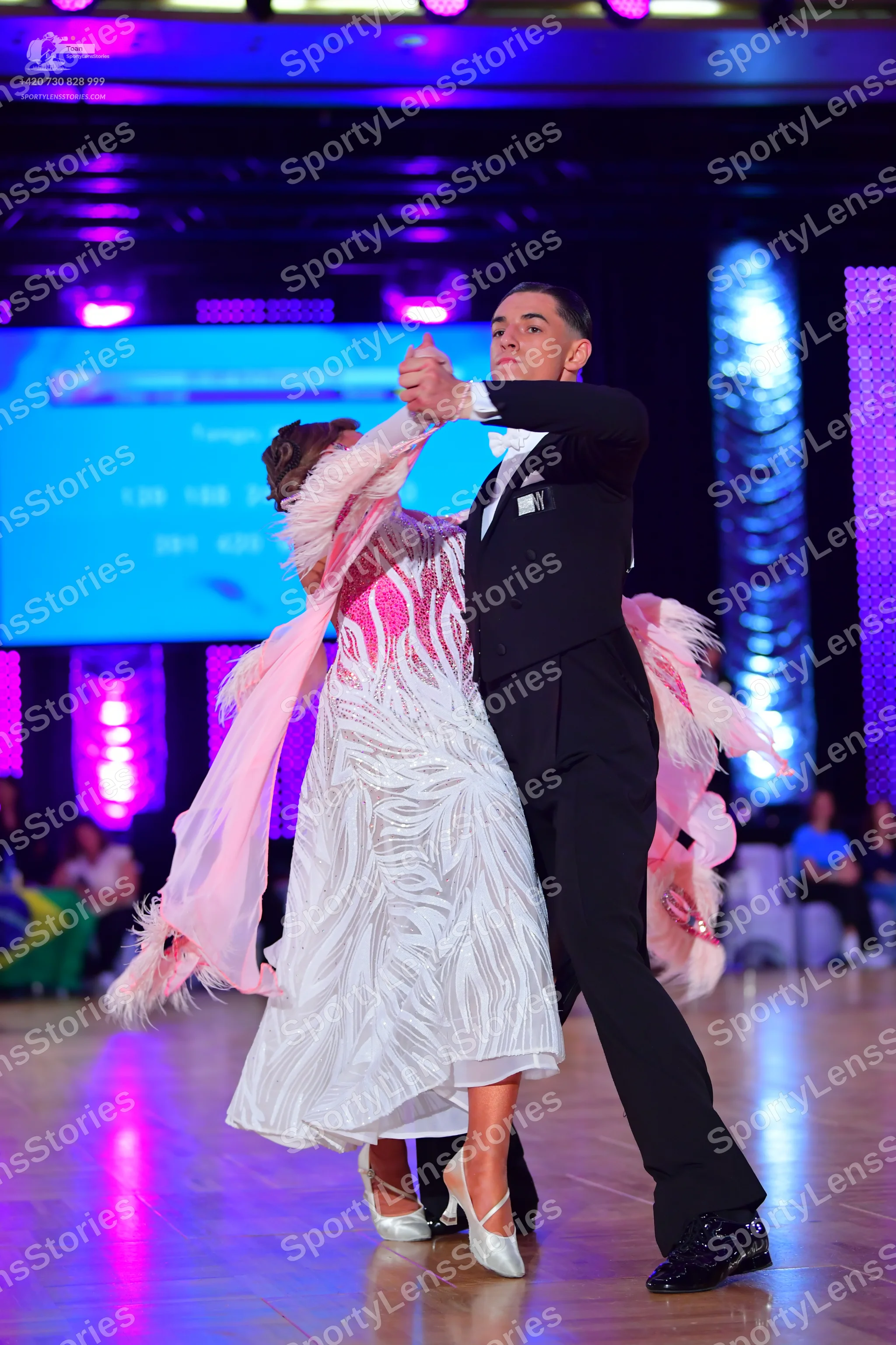 Dancesport competitor: Male dancer: black suit, white shirt, and black trousers