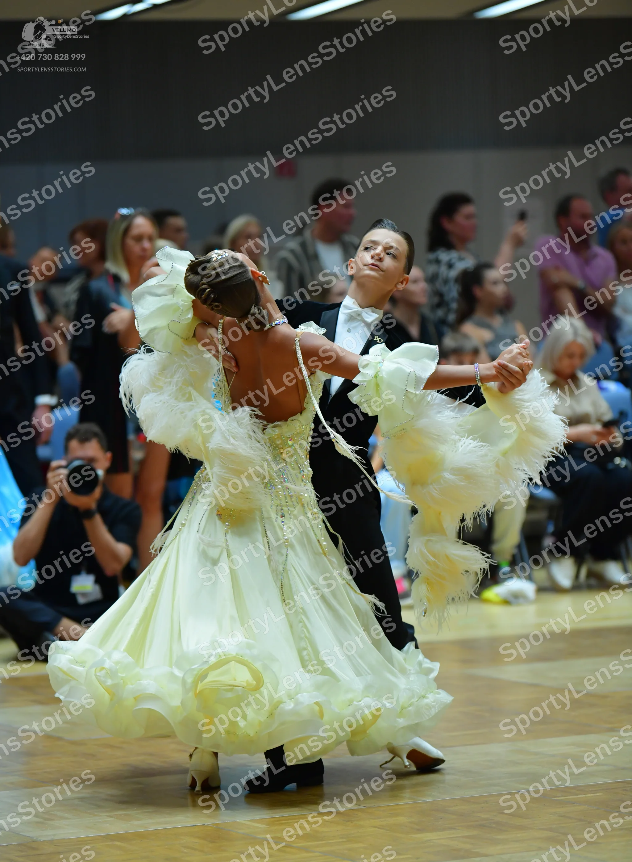 Dancesport competitor: Male dancer: black suit, white shirt, and black bow tie