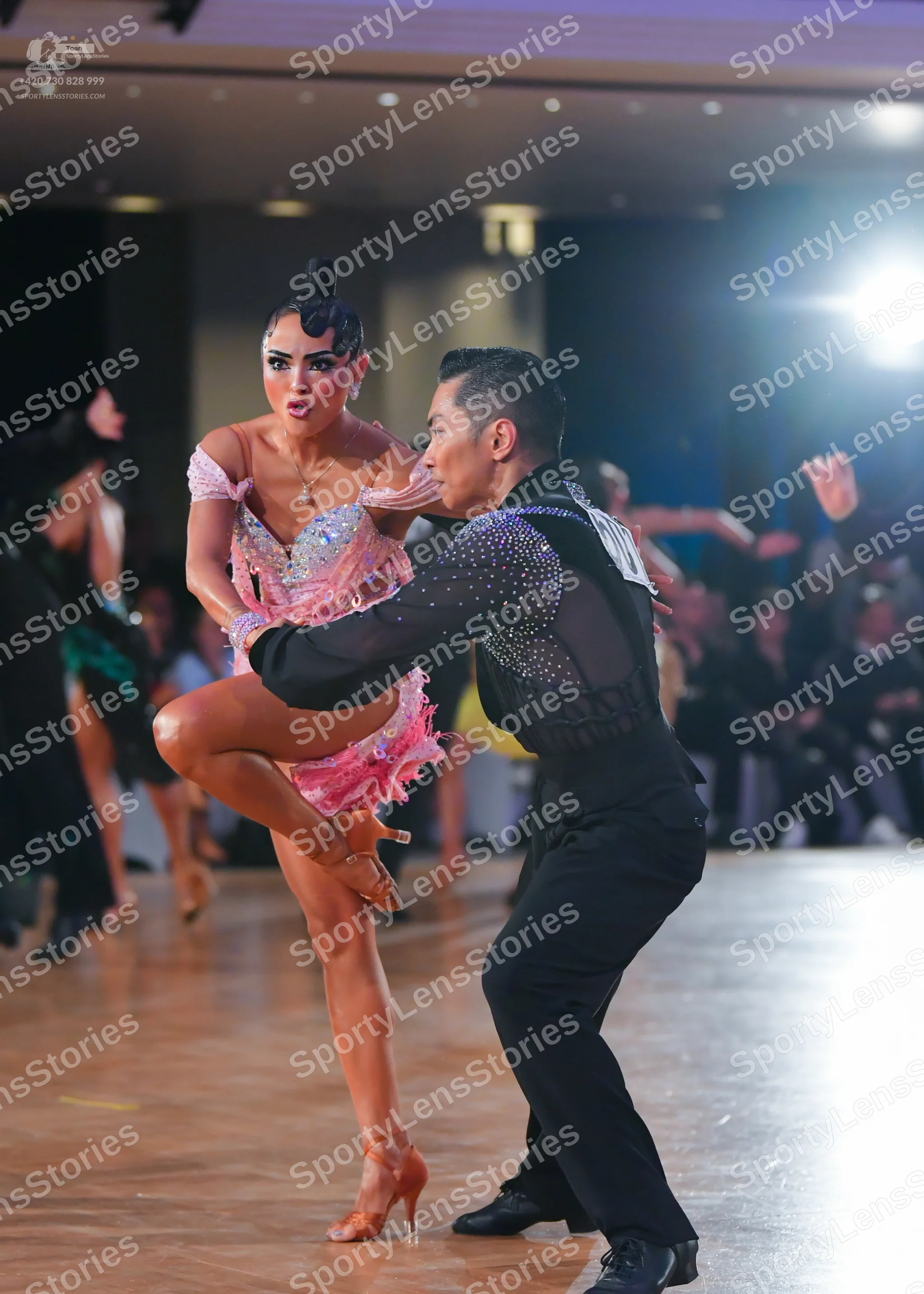 Dancesport competitor: Male dancer: black long-sleeved shirt with small sparkling embellishments on the