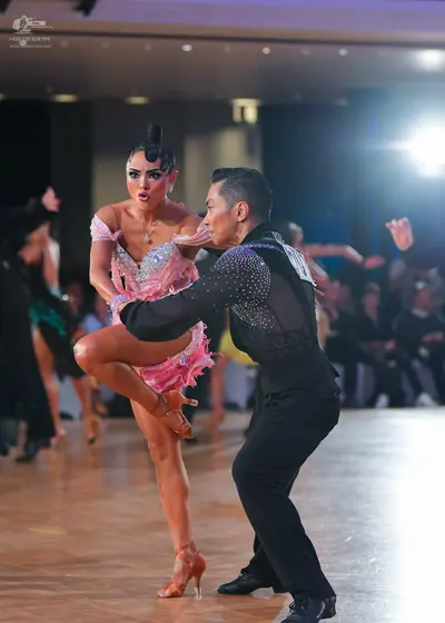 Dancesport competitor: Male dancer: black long-sleeved shirt with small sparkling embellishments on the
