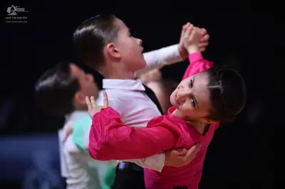 Dancesport competitor: Male dancer: white long-sleeved shirt