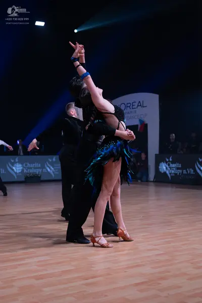Dancesport competitor: Male dancer: black suit
