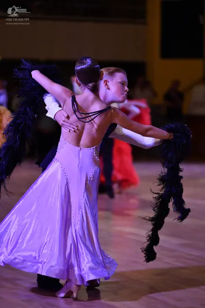 Dancesport competitor: ** Black tailsuit