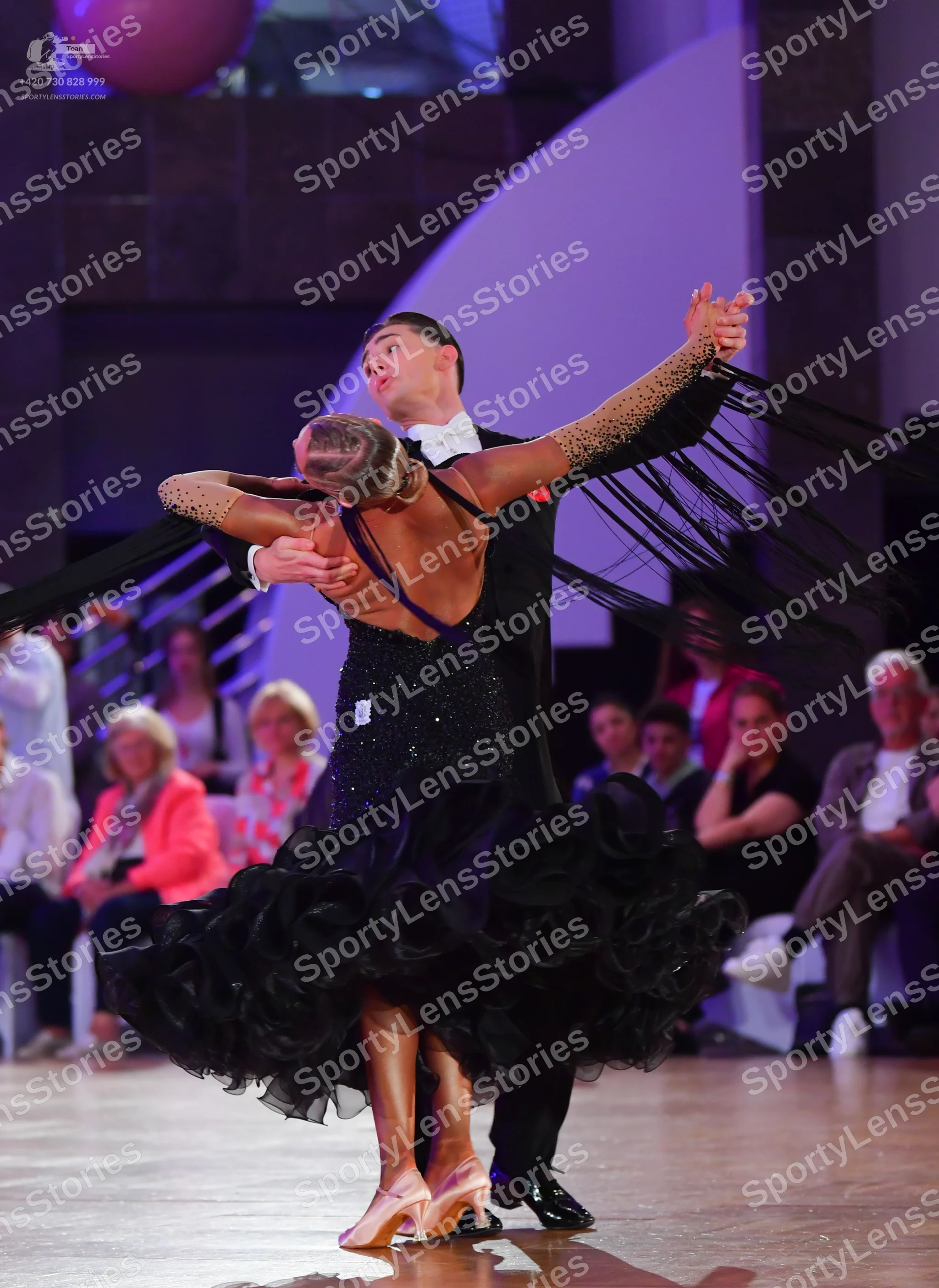 Dancesport competitor: Male dancer: black suit with a white shirt and white bowtie