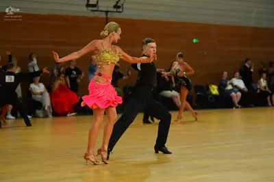 Dancesport competitor: Male dancers: black shirts and trousers