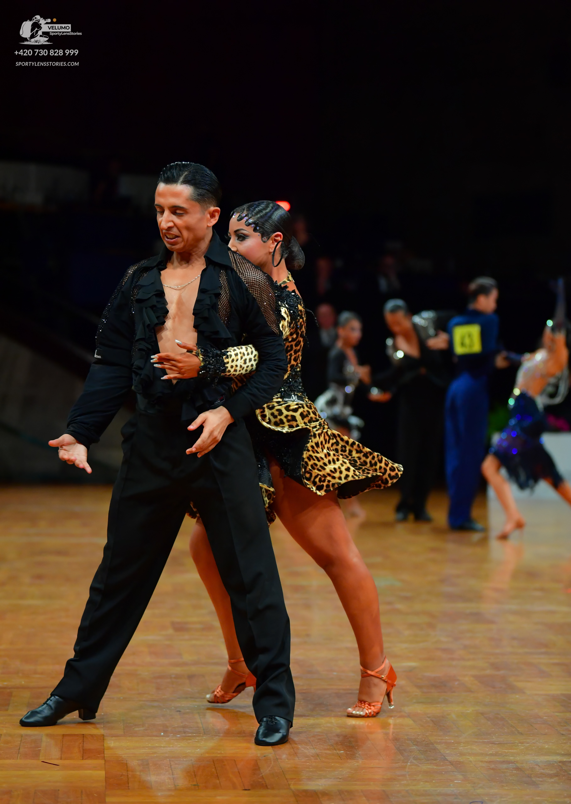 Dancesport competitor: Male dancer: black long-sleeved shirt and black trousers