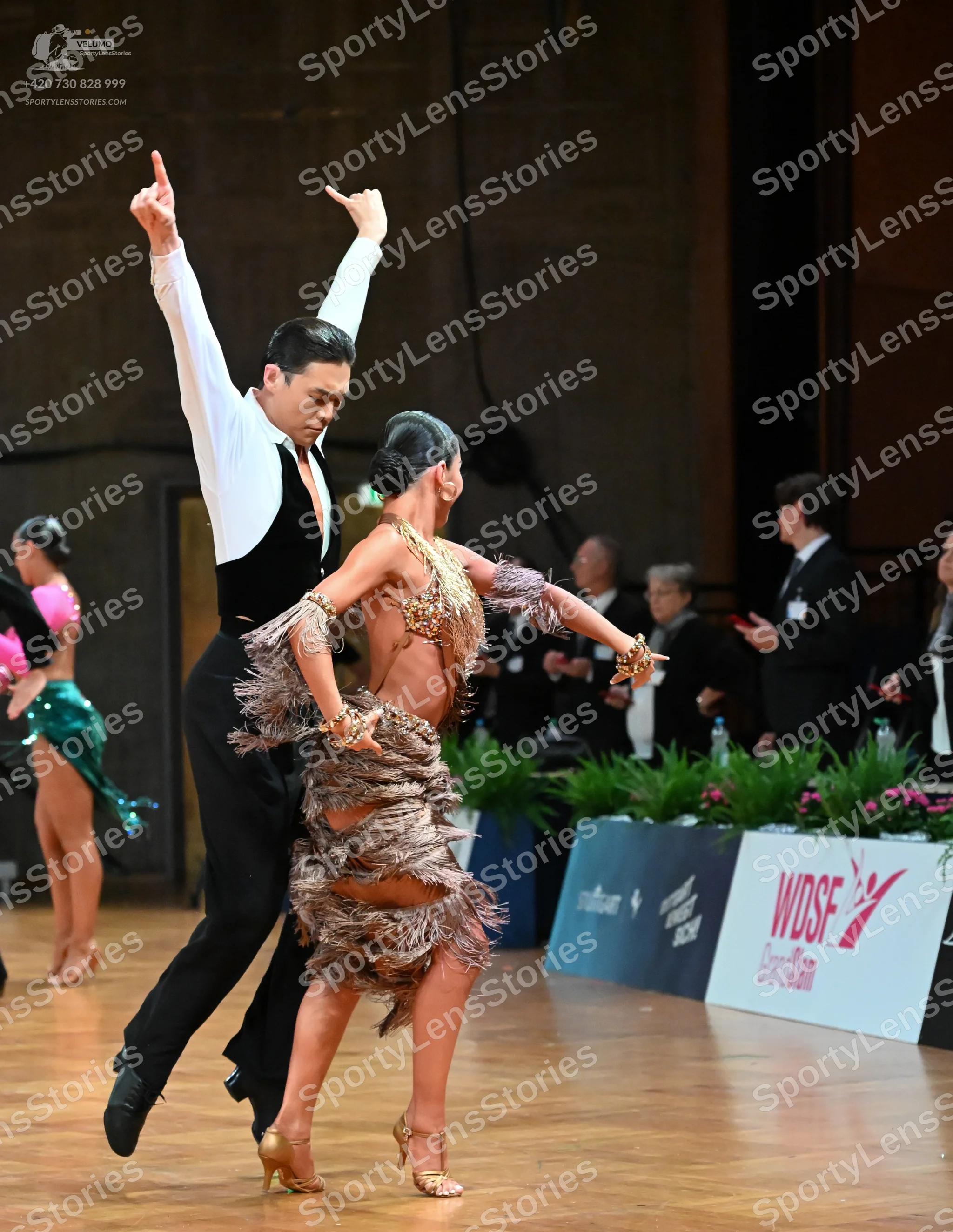 Dancesport competitor: Male dancer: white long-sleeved shirt, black waistcoat, and black trousers
