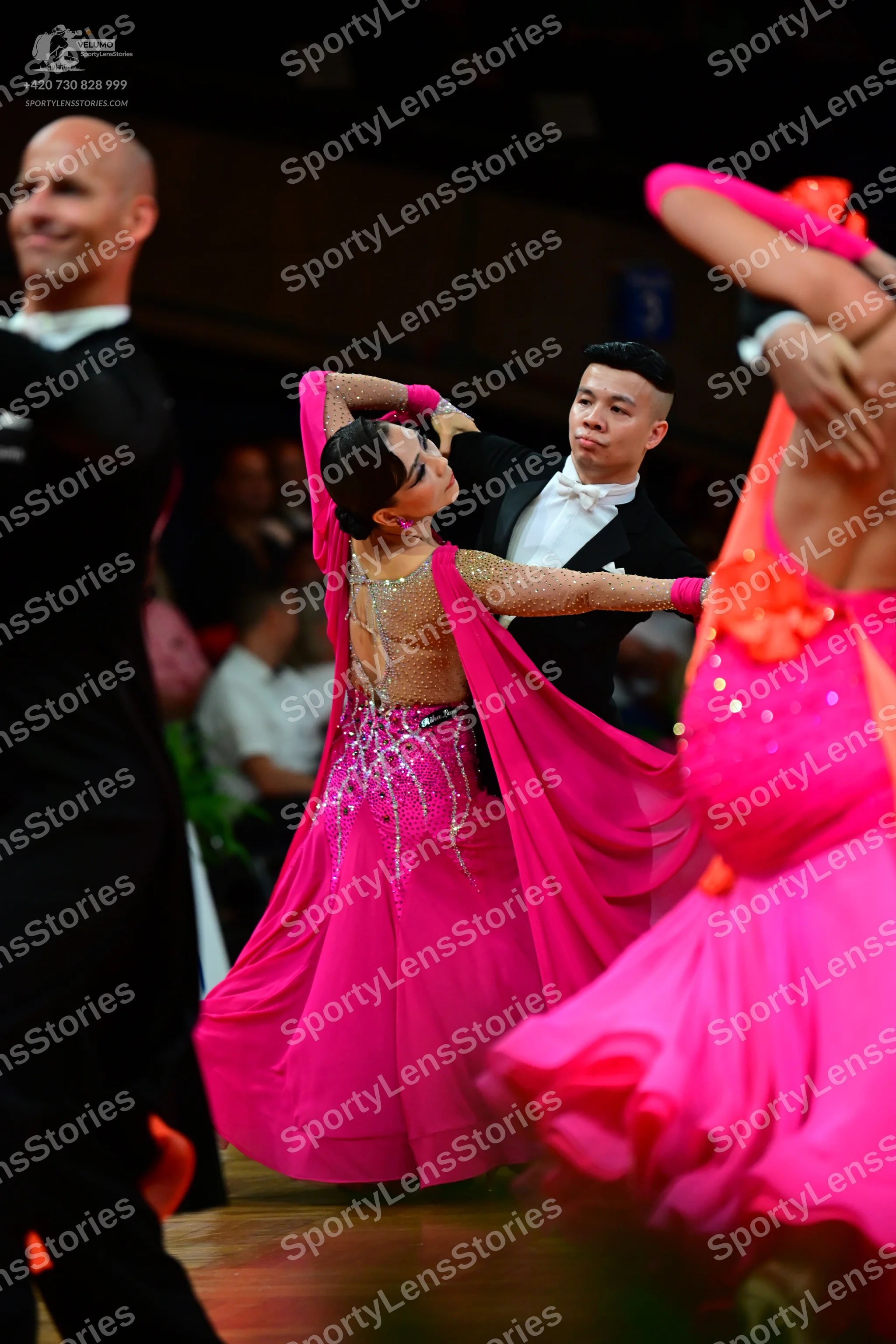 Dancesport competitor: Male dancers: black suits with white shirts and white bowties