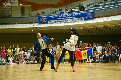 Dancesport competitor: Male dancer: blue blazer, white shirt, and black trousers