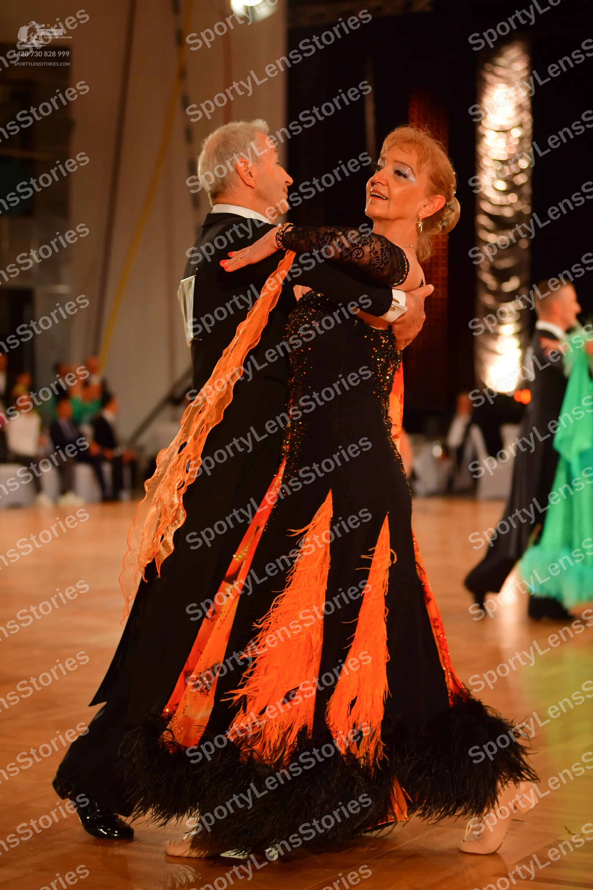 Dancesport competitor: Male dancer: black suit with a white shirt