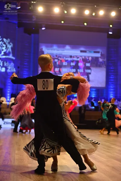 Dancesport competitor: Male dancer: black suit