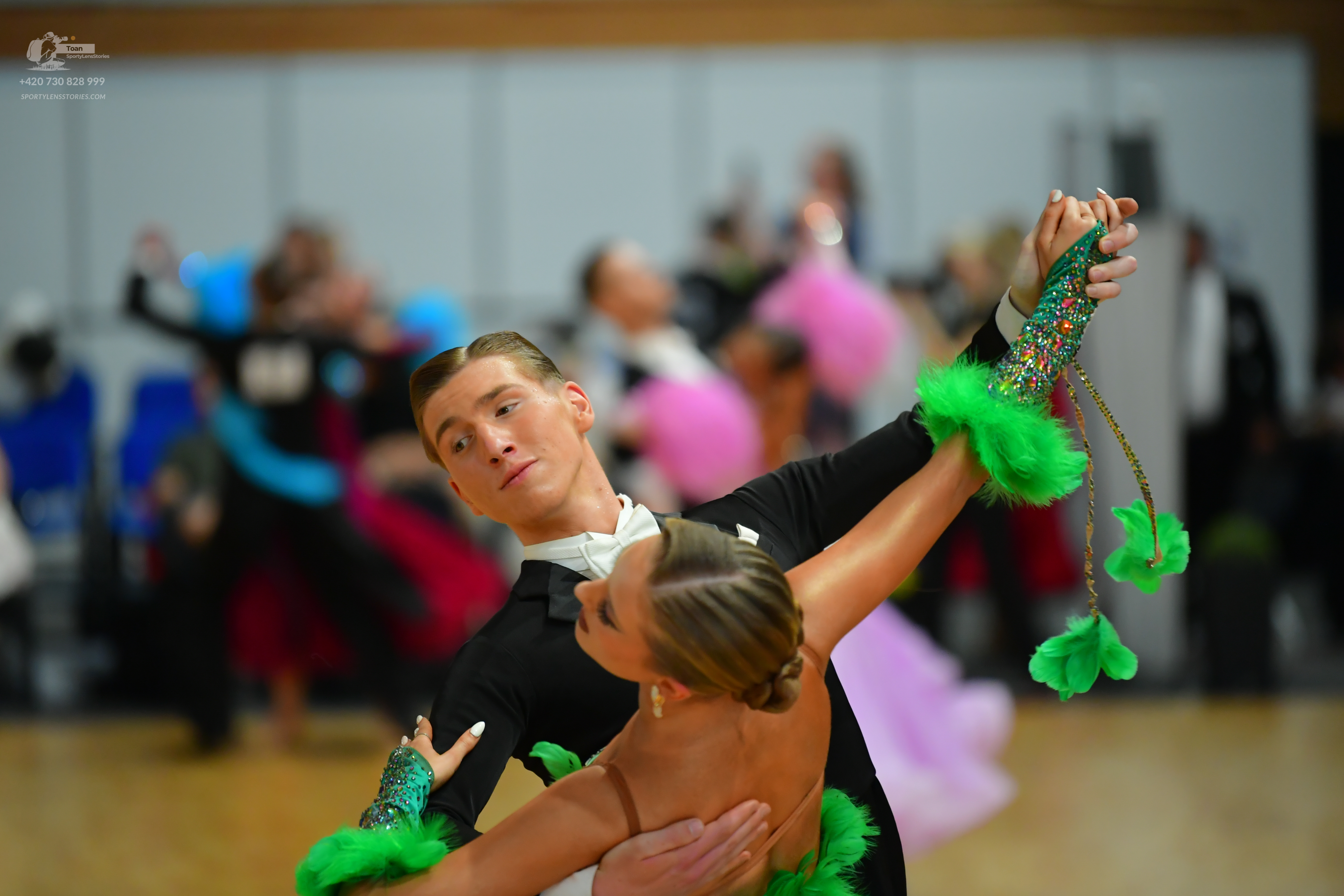 Dancesport competitor: Male:** Black tailsuit with sequin lapels and a white bow tie