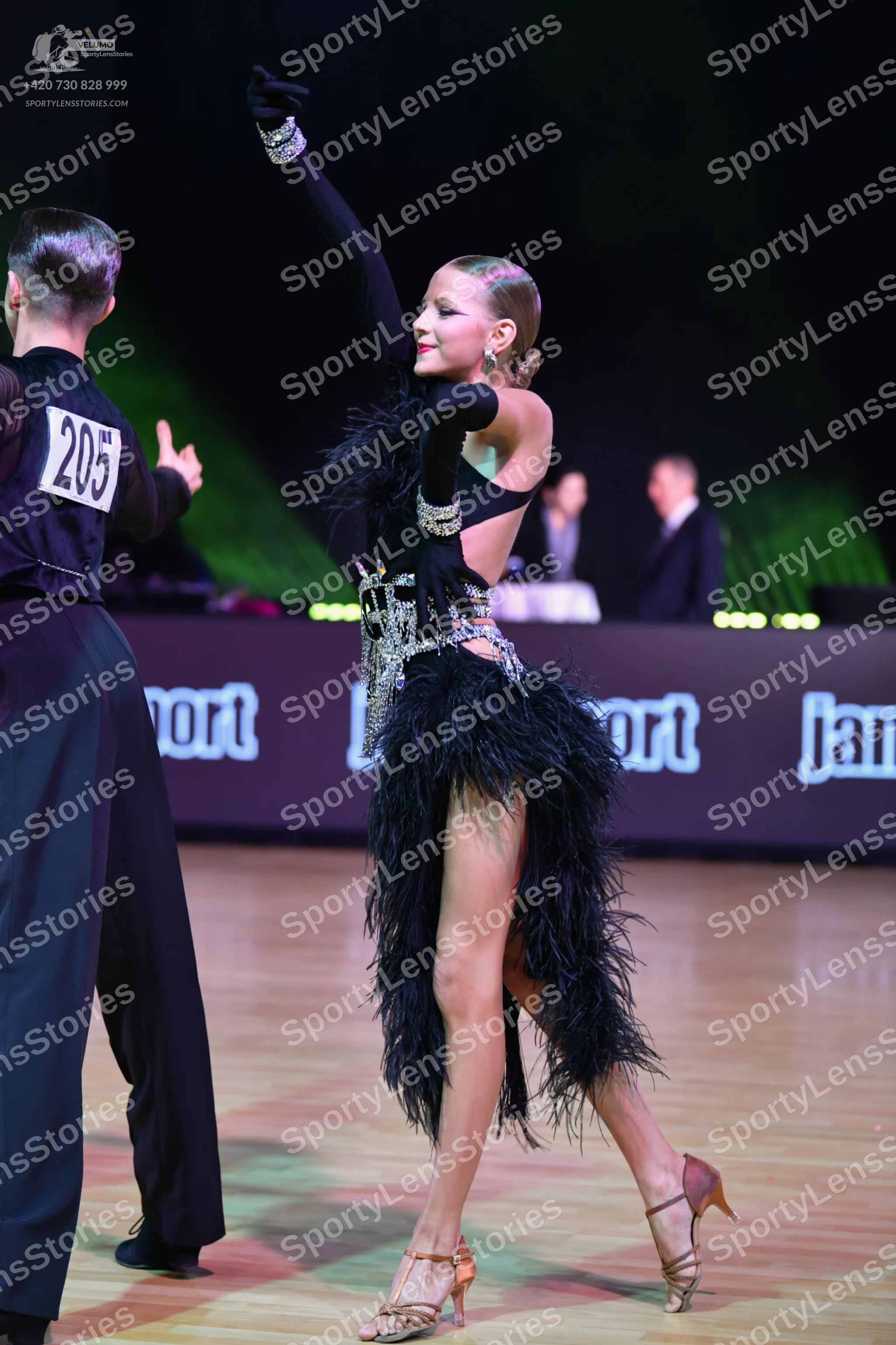 Dancesport competitor: Male dancer: black long-sleeved shirt and black trousers