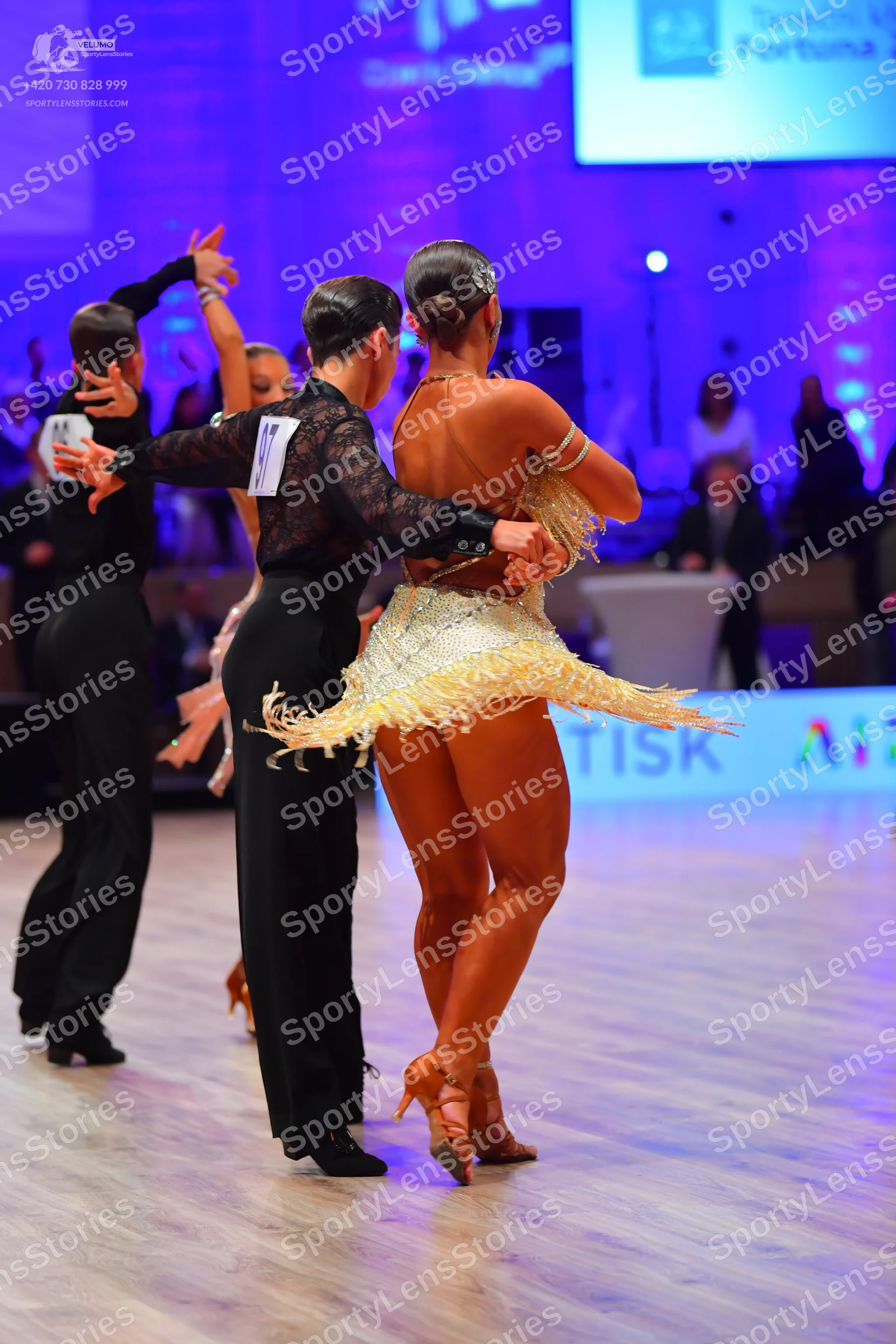 Dancesport competitor: Male dancer (left): black long-sleeved shirt and black trousers
