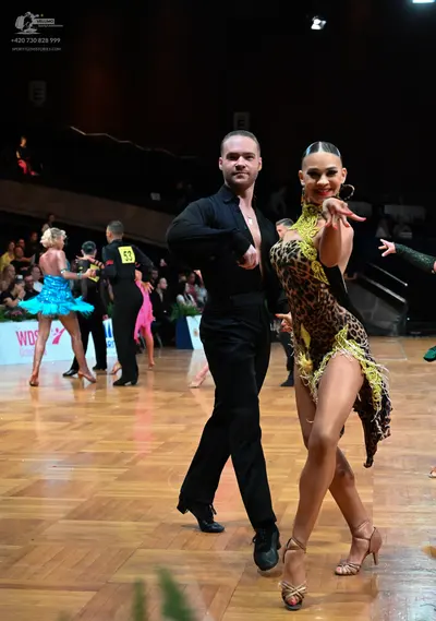 Dancesport competitor #53: Male dancer: black long-sleeved shirt and black trousers