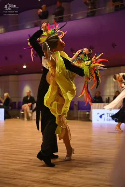 Dancesport competitor: Male dancer: black ballroom suit