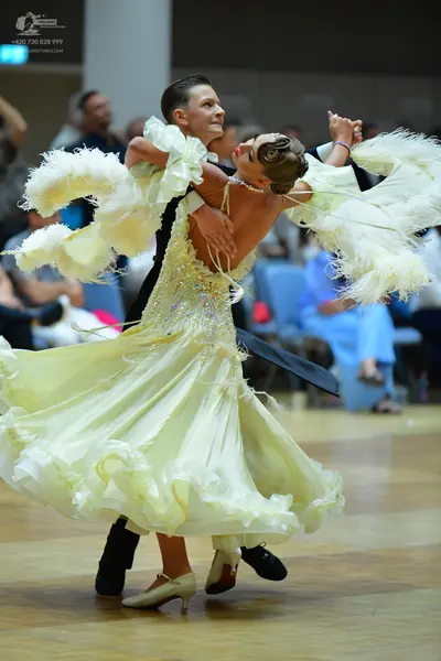 Dancesport competitor: Male dancer: black suit with satin lapels