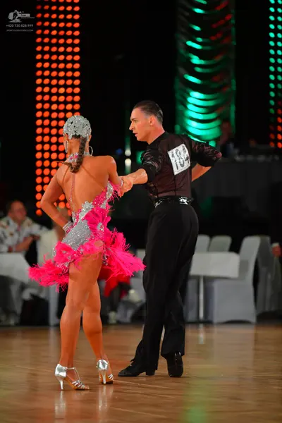 Dancesport competitor #164: Female dancer: pink latin dress with silver sequin bodice and pink fringe